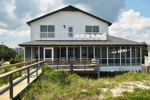 beach home with a large deck