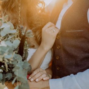 Bride and groom close-up at sunset