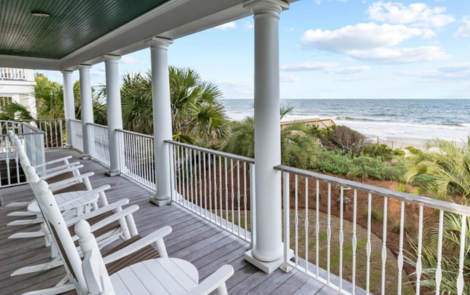 Porch with rocking chairs facing the ocean