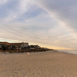 Pawleys Island, USA - 17 March, 2026: panorama view of the first row homes and endless beach of Pawleys Island at sunrise